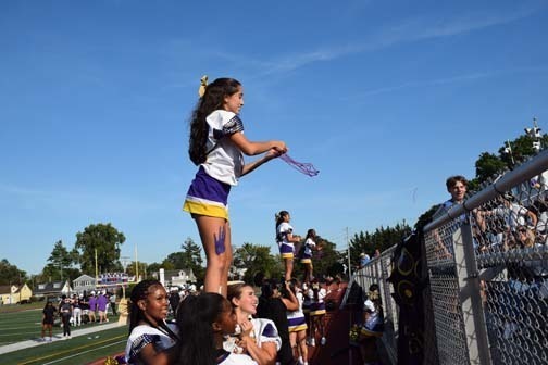 Cheerleaders and crowd are pictured during the game.