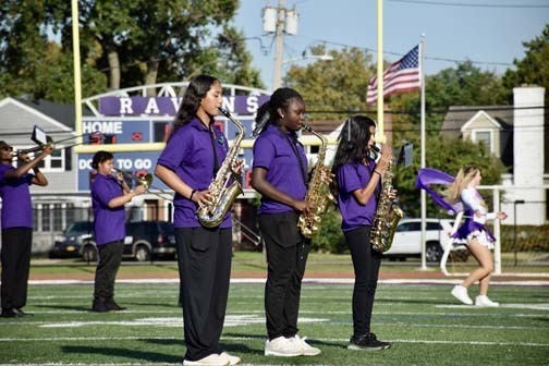 The marching band performs during halftime. 