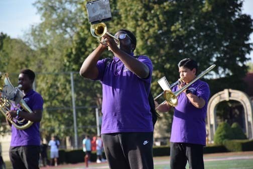 The marching band performs during halftime. 