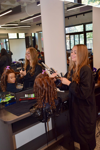 students styling hair