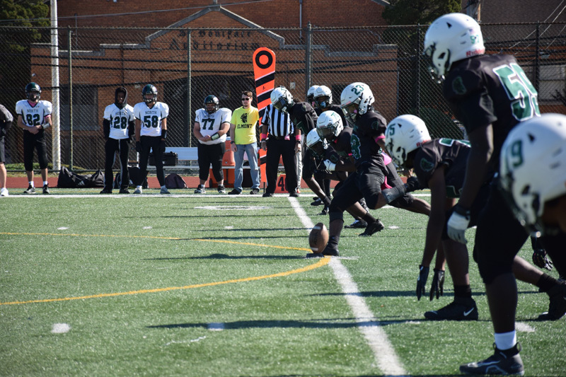 students in football game