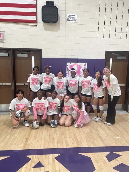 Student group photo with students wearing pink.