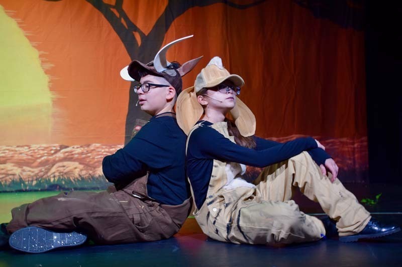 Students on stage preforming 'Lion King'