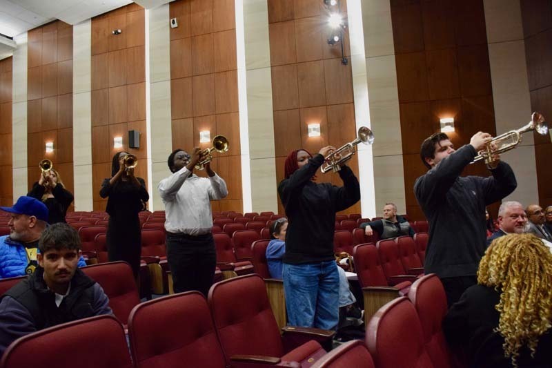 Students performing on stage.