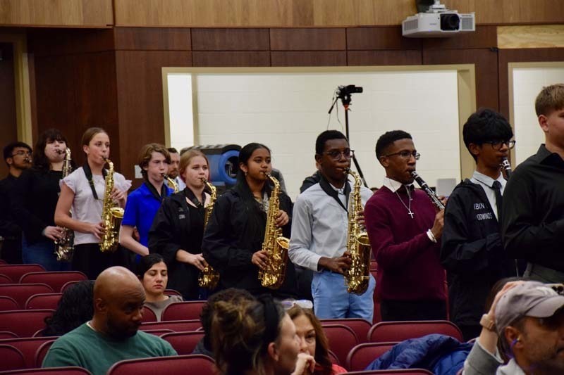 Students performing on stage.