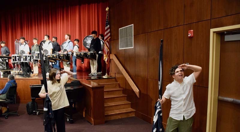 Students performing on stage.