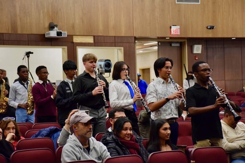 Students performing on stage.