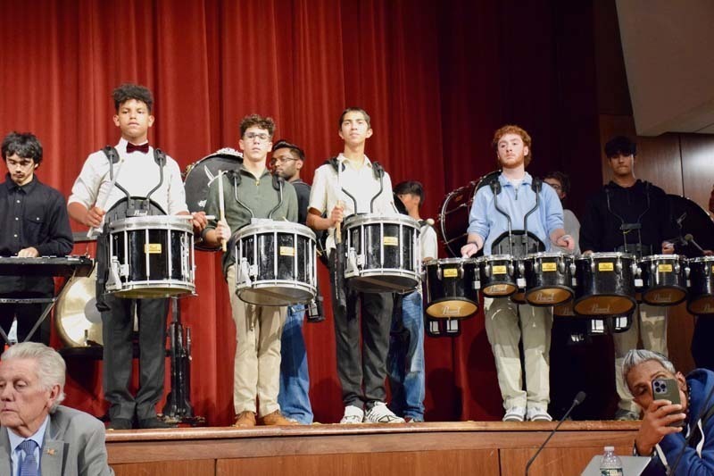 Students performing on stage.