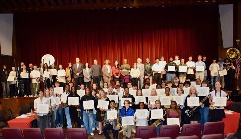 Students performing on stage.