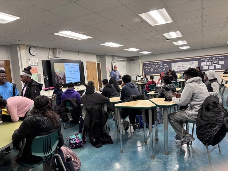 Students sitting at desk for seminar.