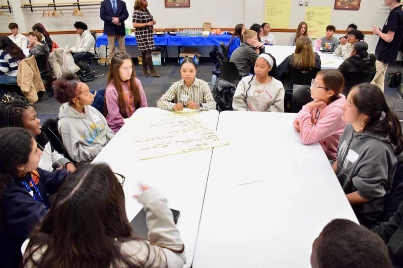 Students gathered around table.