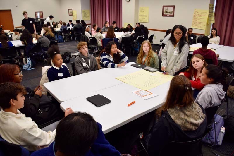 Students gathered around table.