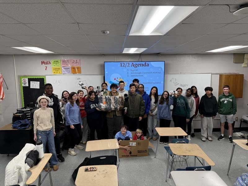Students sitting together at table.