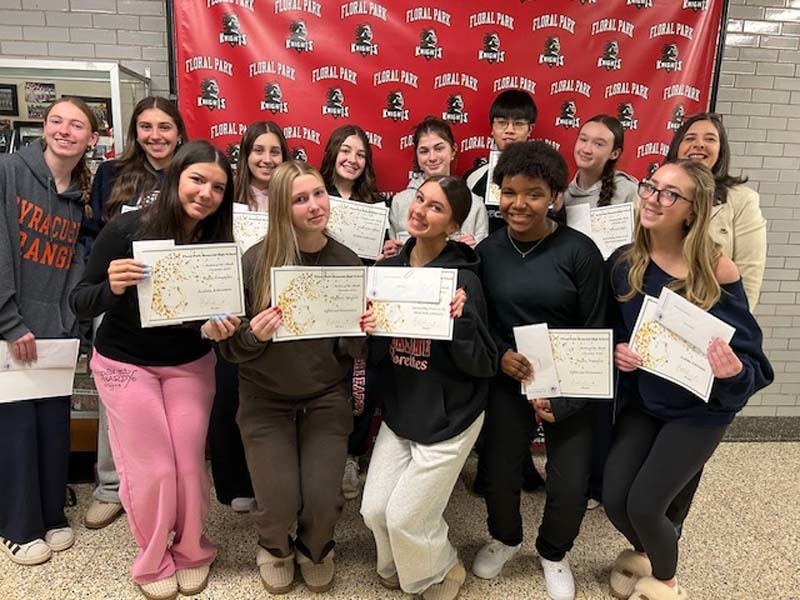 Students holding certificates