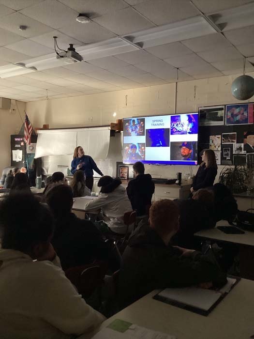 Guest speaker speaking to students in classroom.