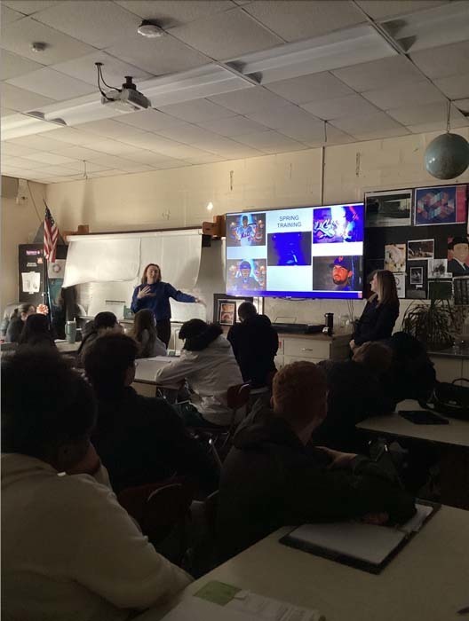 Guest speaker speaking to students in classroom.