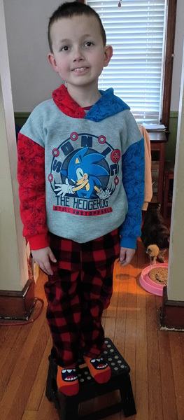 young student in pajamas