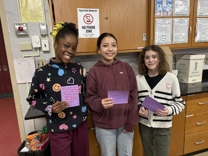 students with purple paper craft