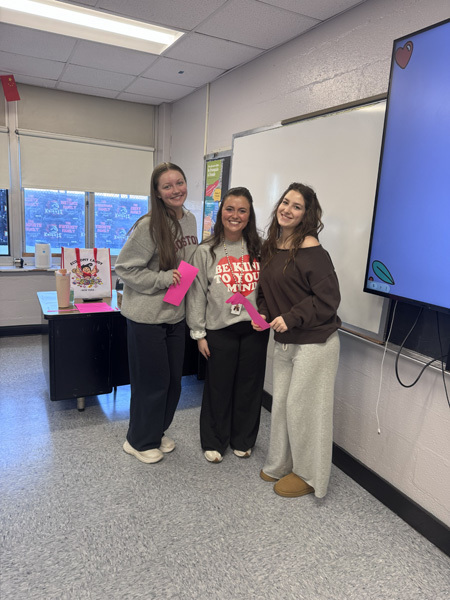 student with neon pink  paper craft