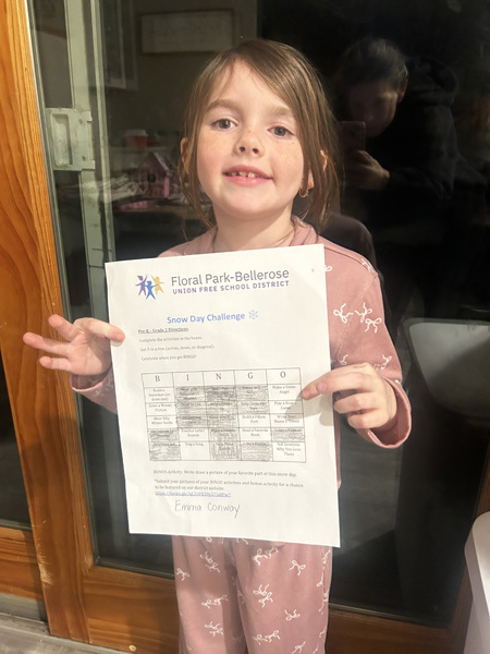 studentholding up white letter