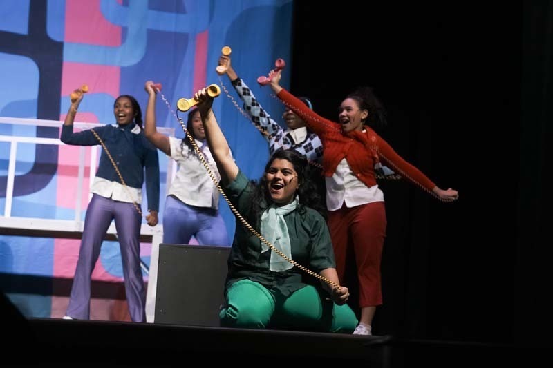 Students dressed in costume performing.