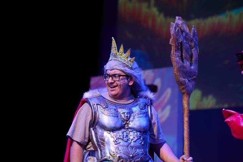 Students performing in costume.