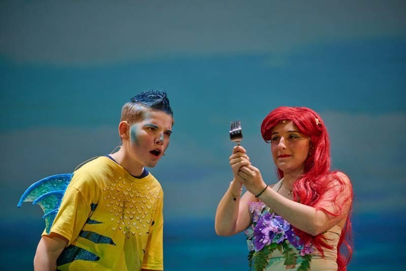 Students performing in costume.