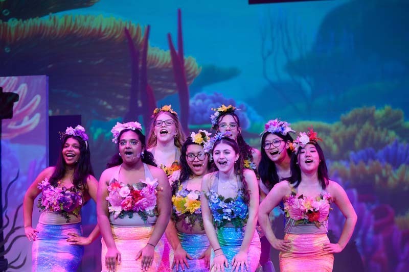 Students performing in costume.