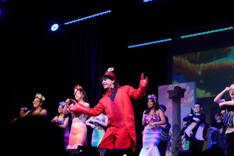 Students performing in costume.