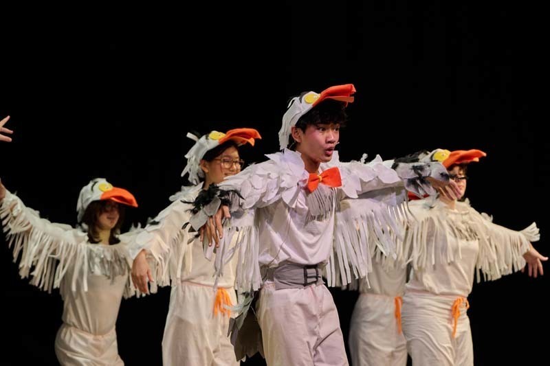 Students performing in costume.