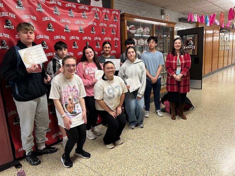Students holding certificates