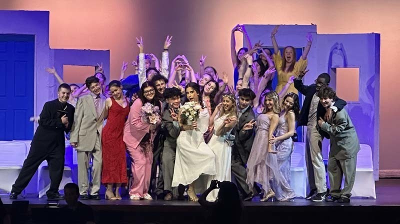 Students performing on stage.