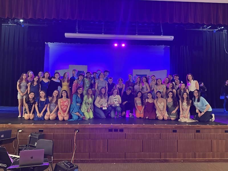 Students performing on stage.