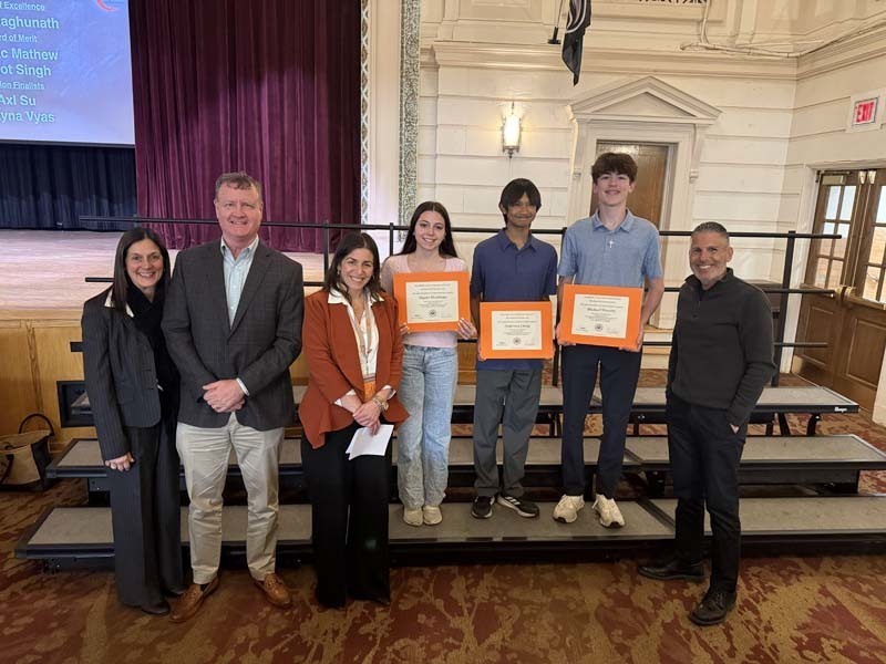 Students smiling with PTSA members.