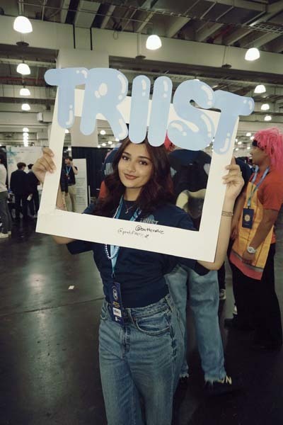 Student with head in cardboard cut-out.