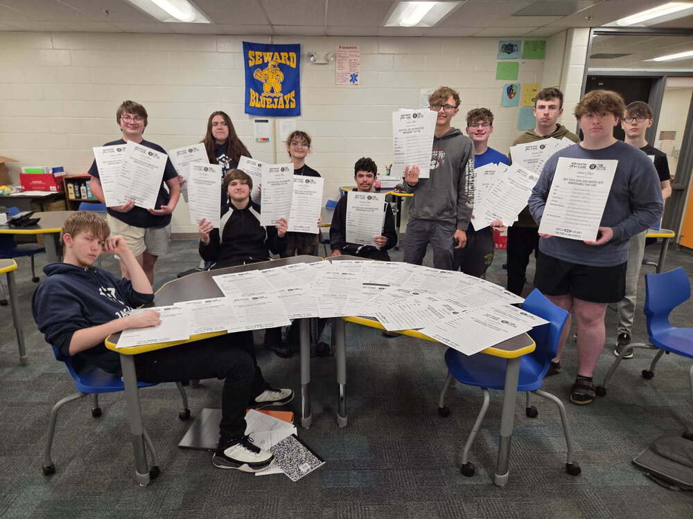 JAG students helping with posters