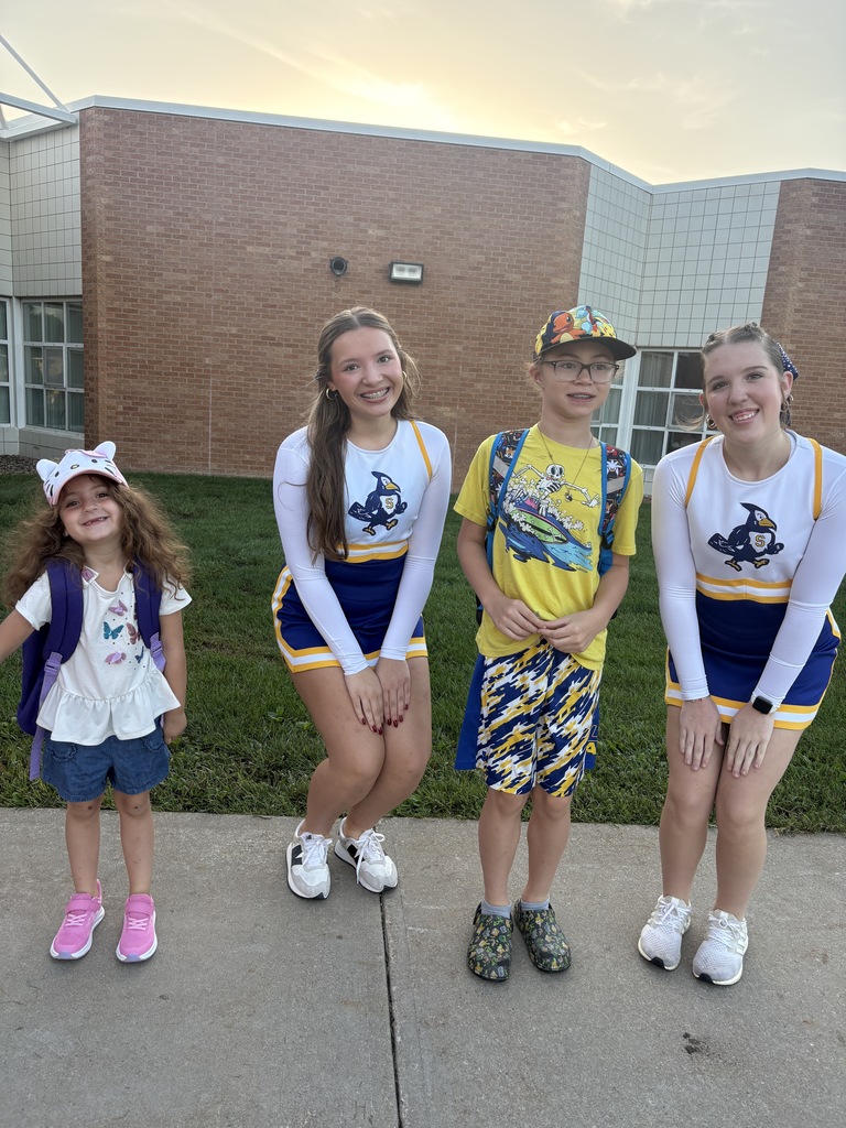 Cheering and smiling while wearing hats to support childhood cancer awareness.