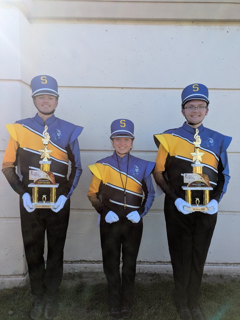 drum majors with trophies 