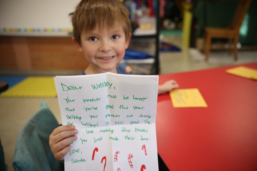 HS Students Reading Santa Letters to TS Students