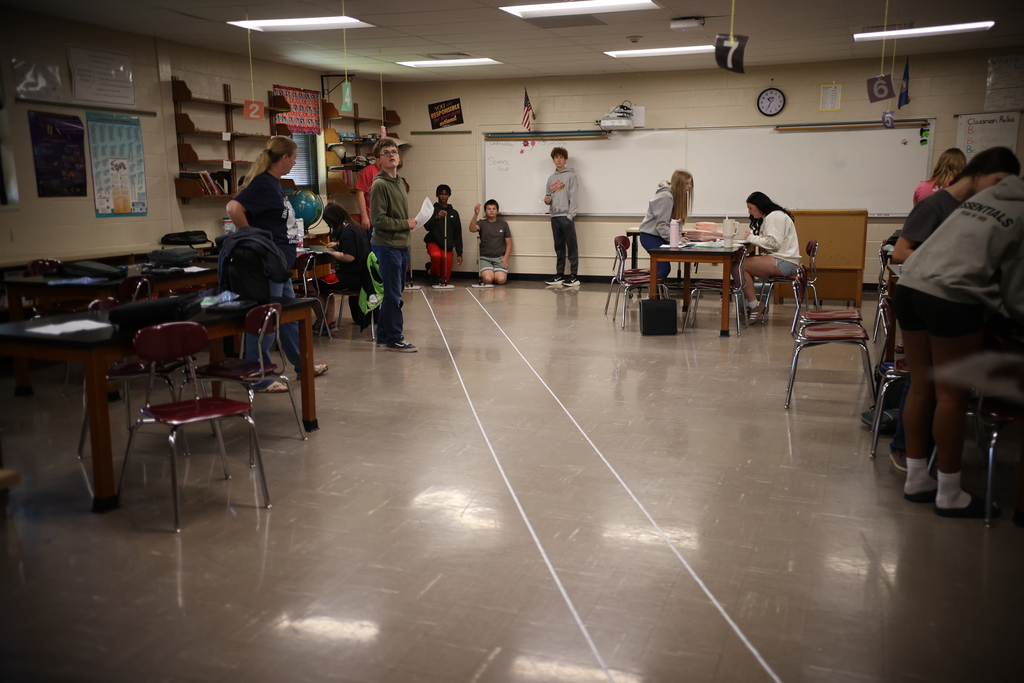 Students working on and launching straw rockets.