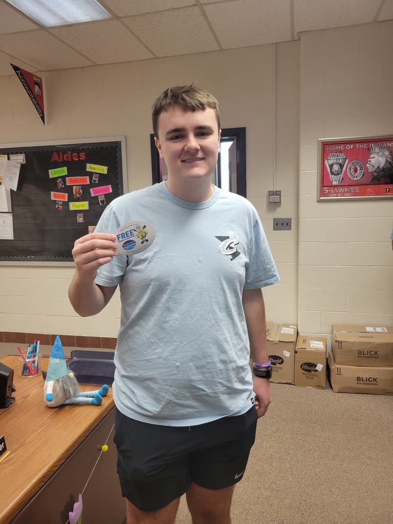 Pictures of the winning students showing the prizes they were awarded for student recognition.