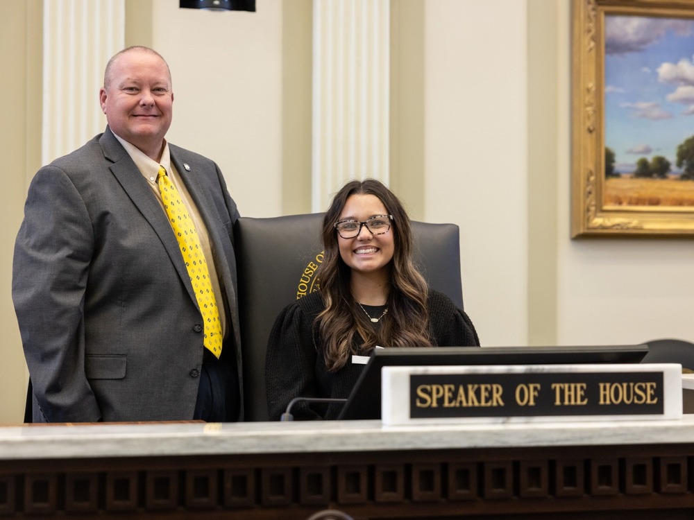 Man and teenage girl in house chambers