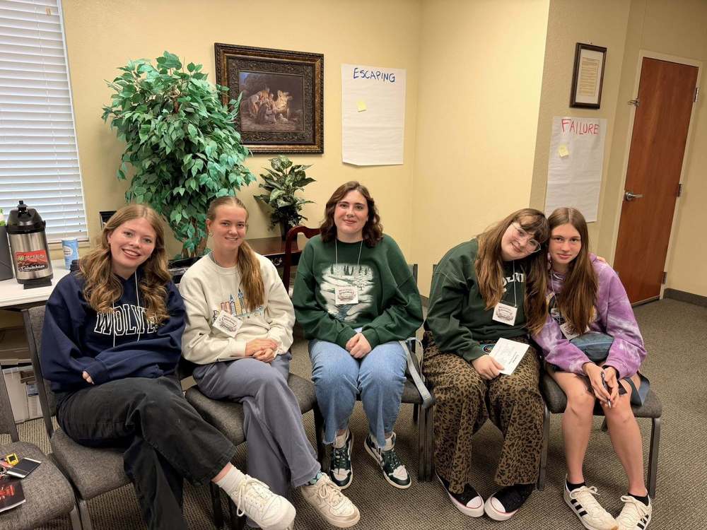 image of five high school girls sitting in chairs