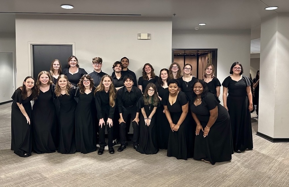 group of high school students in black posing