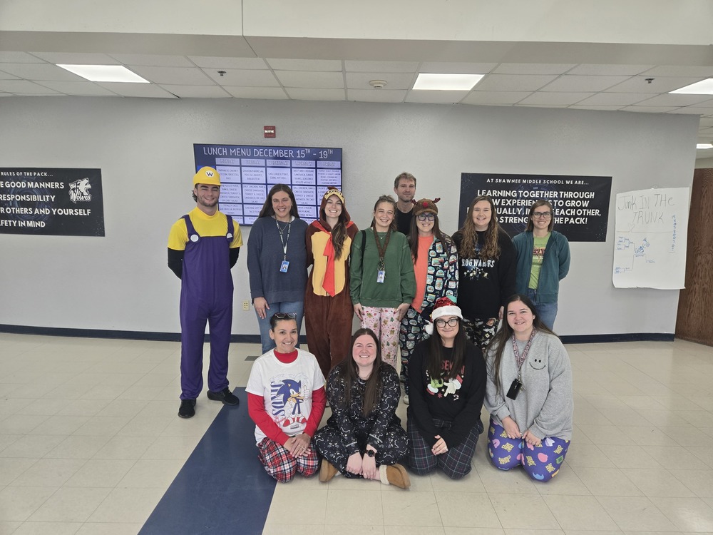 group of adults in christmas pajamas