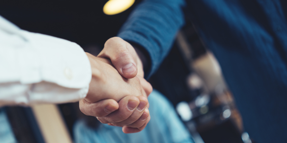 an image of two people shaking hands