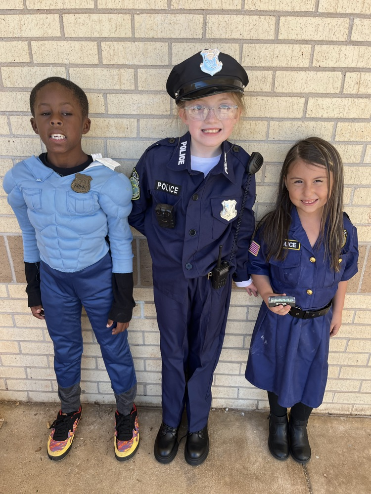 three children dressed like police officers