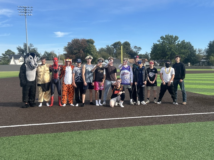 high school students in costumes on field 