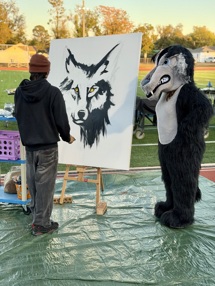 painting of a wolf with wolf mascogmascot
