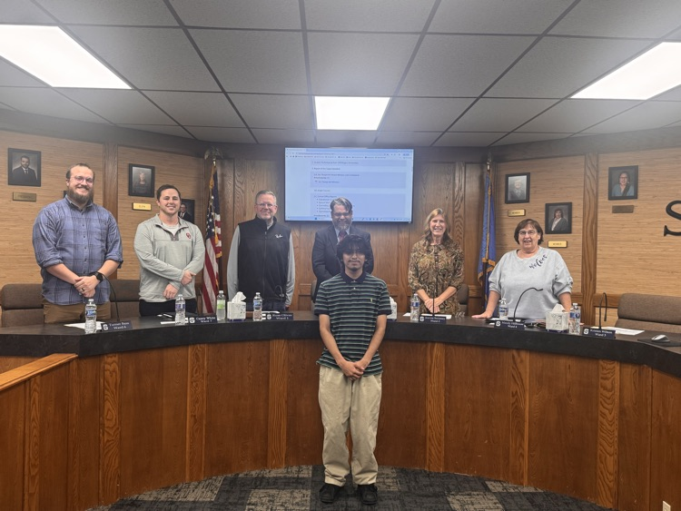 group of adults posing for photos
